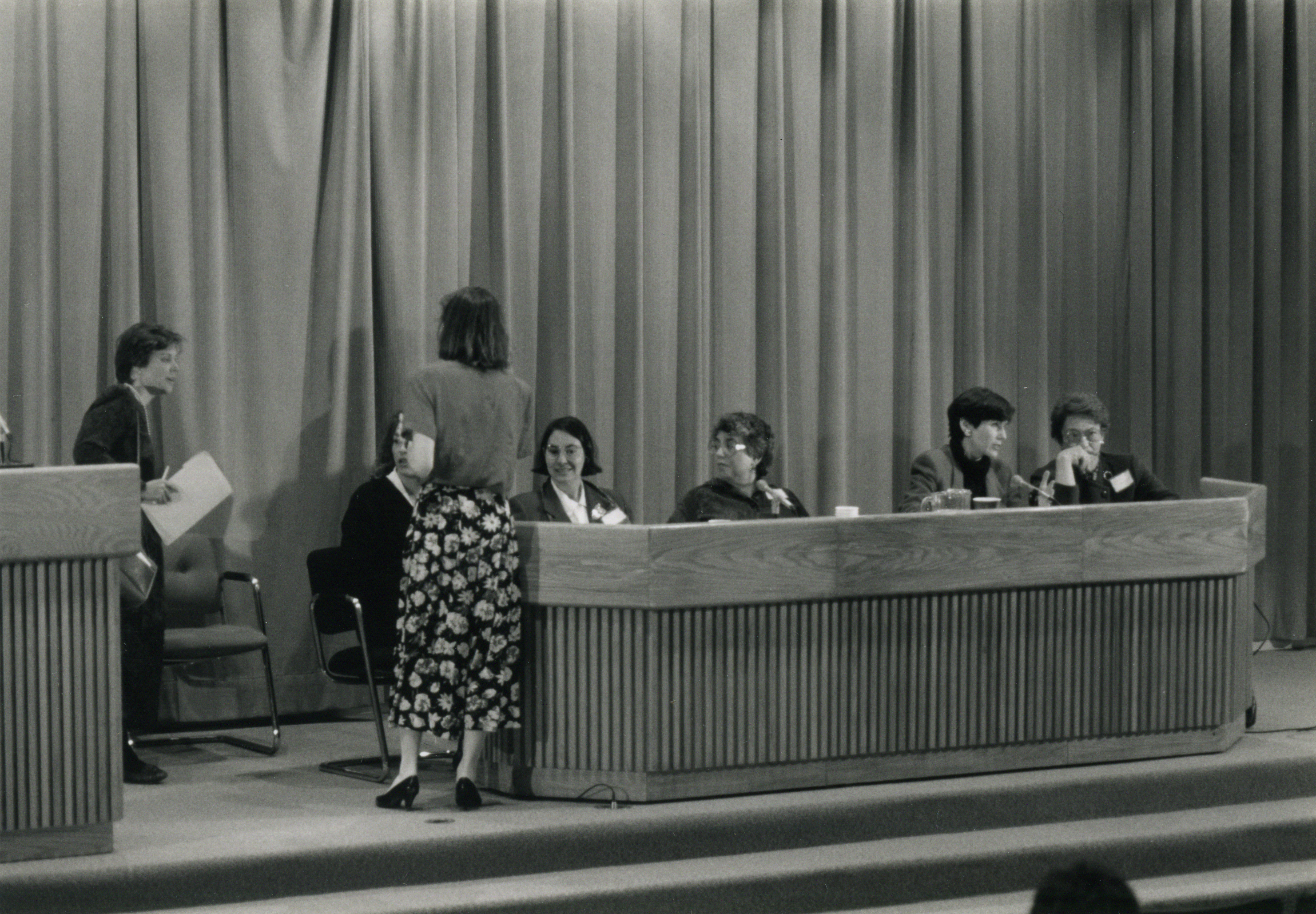 Black and white photograph of women on a panel