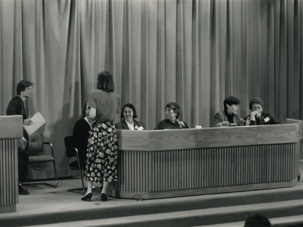 Black and white photograph of women on a panel