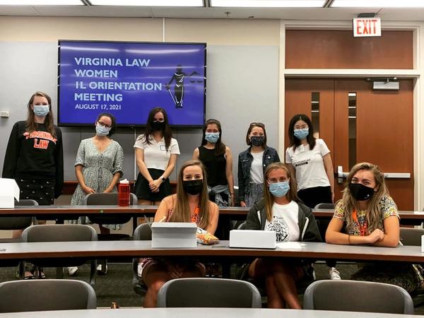 Color photograph of women wearing face masks in lecture hall