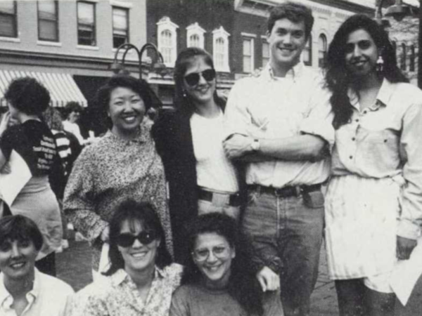 Black and white photograph of smiling people in Downtown Charlottesville
