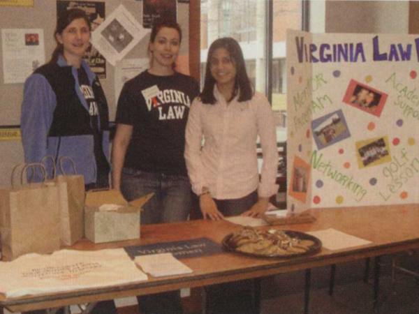 Color photograph of three women tabling